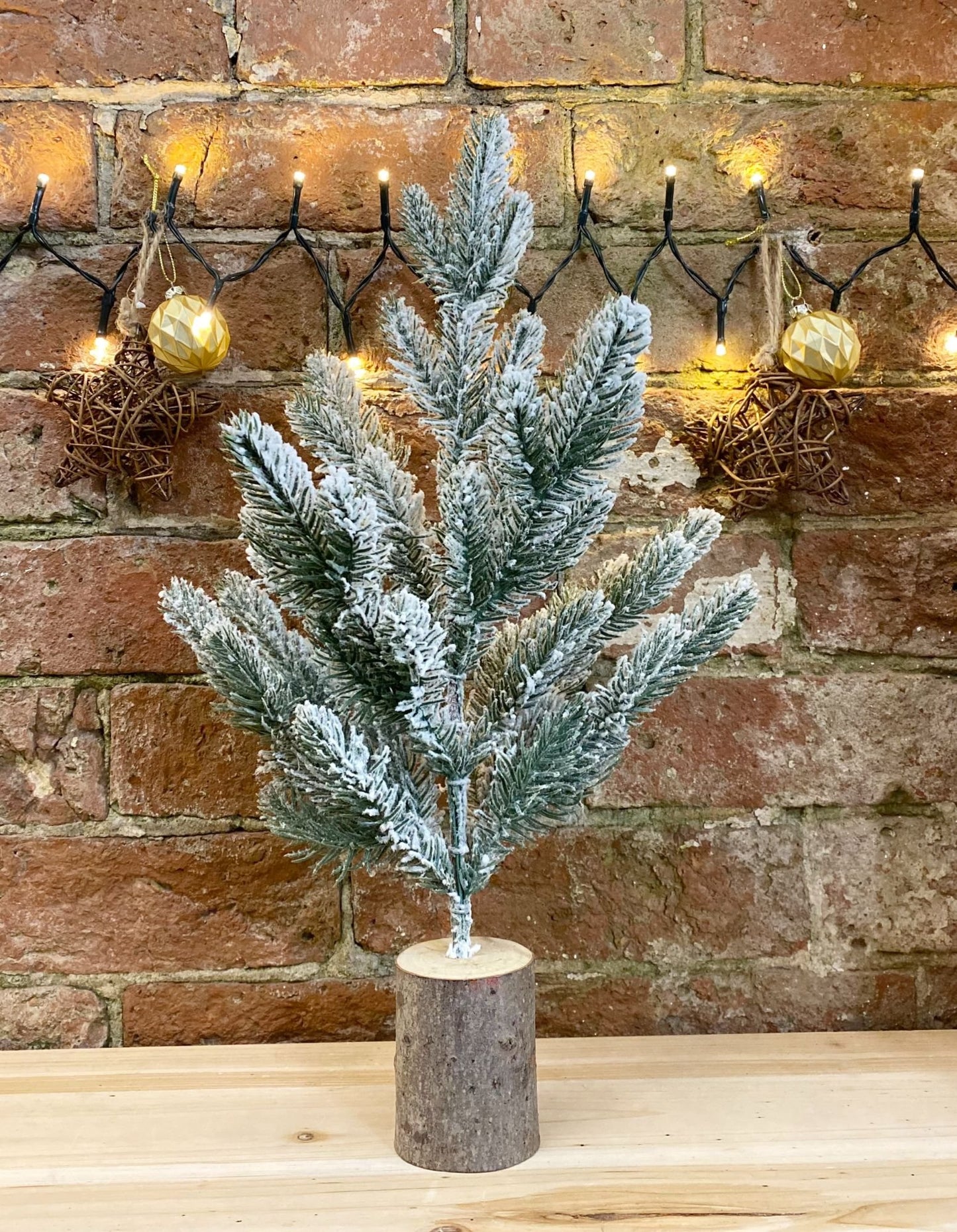 Small Frosted Christmas Tree In Log